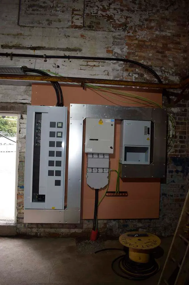 New distribution boards and isolators on a plant room wall