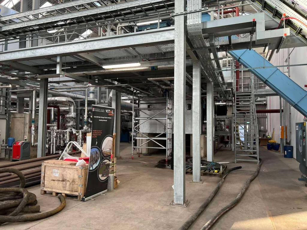 Heating plant hall with access stairs and pipework